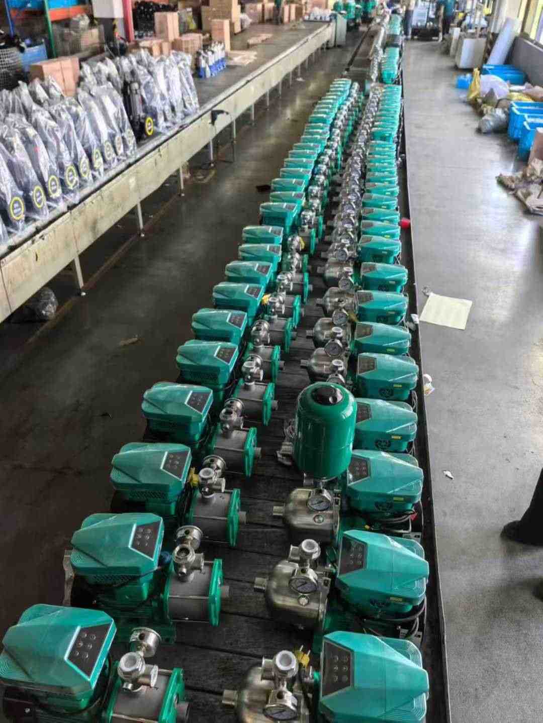Real production-floor photo of pump VFD units prepared for water pump applications
